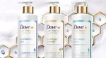 Advertising image showing four bottles in the new Dove Hair Therapy range.